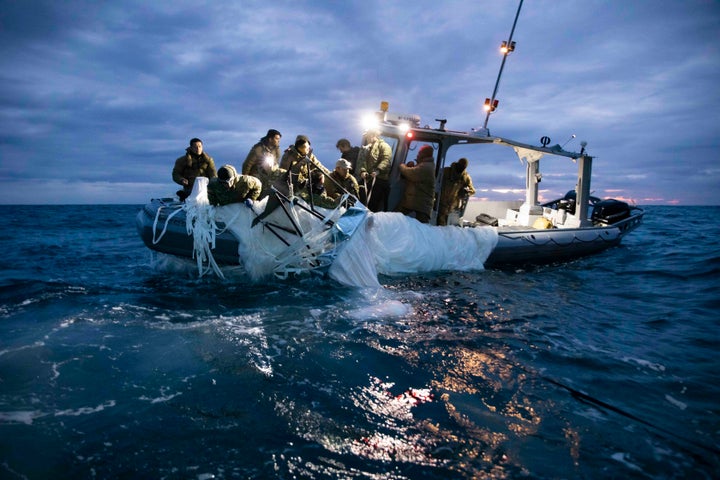 MYRTLE BEACH, SC - FEBRUARY 05: Sailors assigned to Explosive Ordnance Disposal Group 2 recover a high-altitude surveillance balloon on February 5, 2023 off the coast of Myrtle Beach, South Carolina. U.S. fighter aircraft operating under U.S. Northern Command authority engaged and destroyed a high-altitude surveillance balloon over U.S. territorial waters at the order of US President Joe Biden and with the full support of the Canadian Government. (Photo by Petty Officer 1st Class Tyler Thompson/U.S. Navy via Getty Images)