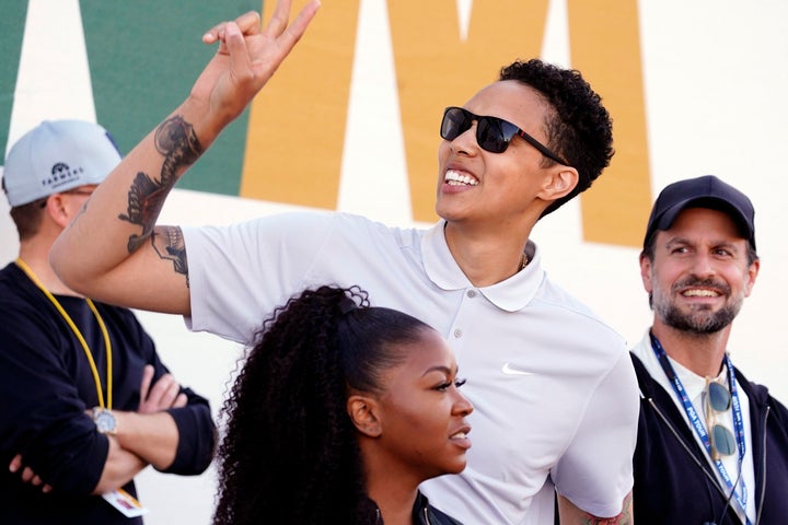 American professional basketball player Brittney Griner acknowledges fans as she watches on the 16th hole during the third round of the Phoenix Open golf tournament, Saturday, Feb. 11, 2023, in Scottsdale, Ariz. (AP Photo/Darryl Webb)