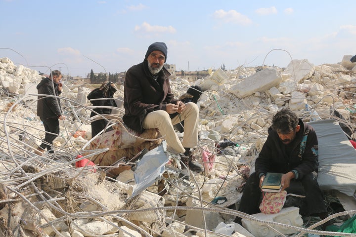 Personnel and civilians conduct search-and-rescue operations Sunday on collapsed buildings in the Etarip district of Aleppo, Syria, after the 7.8-magnitude and 7.5-magnitude earthquakes.