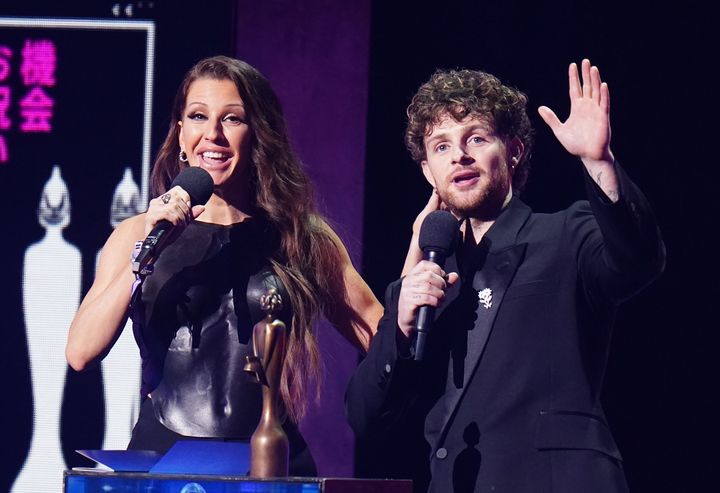 Ellie Goulding and Tom Grennan presenting an award during the Brit Awards 2023 
