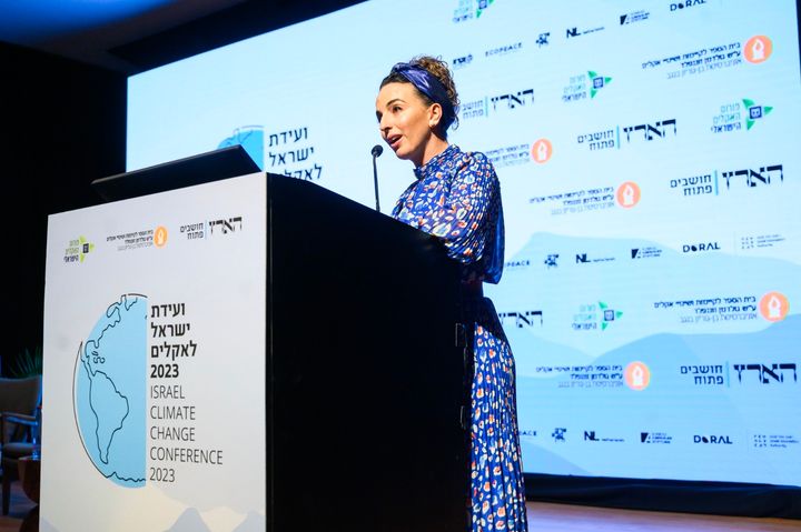 Israel's environment minister, Idit Silman, speaks at a climate summit at Ben-Gurion University on Tuesday before protesters shouted her off the stage.