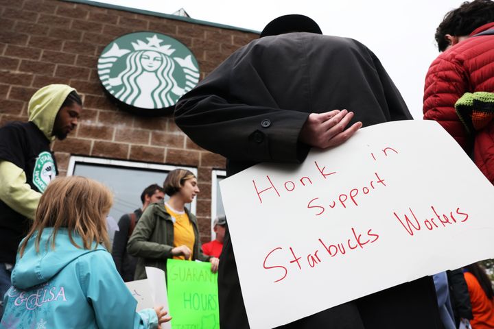 Starbucks workers and union supporters at a rally in New York City in October. The National Labor Relations Board ruled Monday that the company illegally retaliated against baristas in Philadelphia.