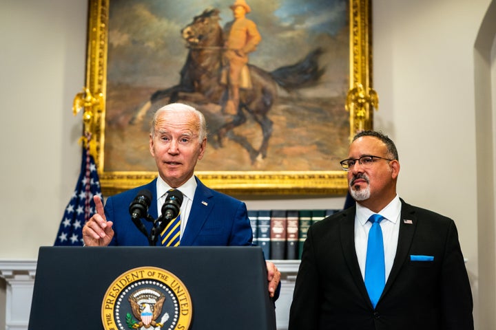 President Joe Biden announces his student-loan debt forgiveness plan in the Roosevelt Room of the White House with Education Secretary Miguel Cardona.