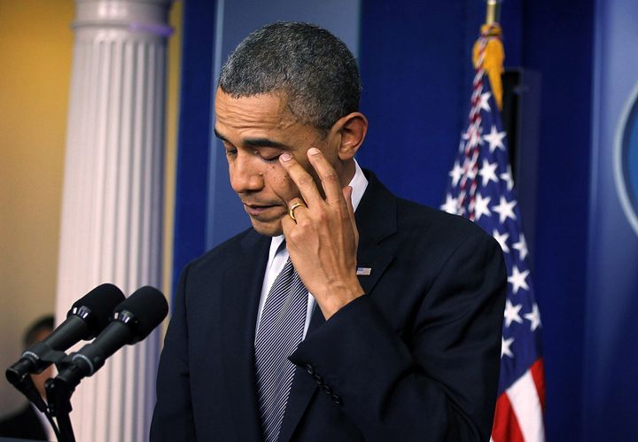 President Barack Obama wipes tears as he makes a statement in response to the shooting at Sandy Hook Elementary School in Newtown, Connecticut, on Dec. 14, 2012.