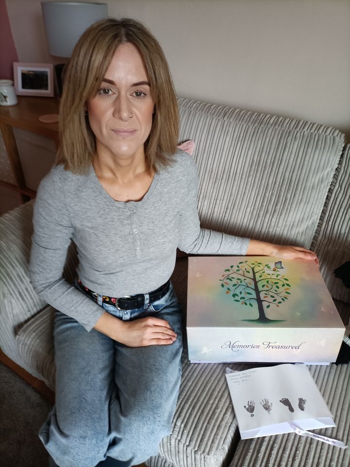 Fiona Lindsay with her memory box and baby's hand and footprints. 