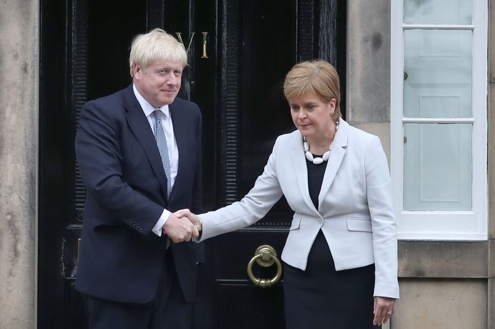 Scotland's first minister Nicola Sturgeon welcomes former prime minister Boris Johnson to Bute House in Edinburgh.