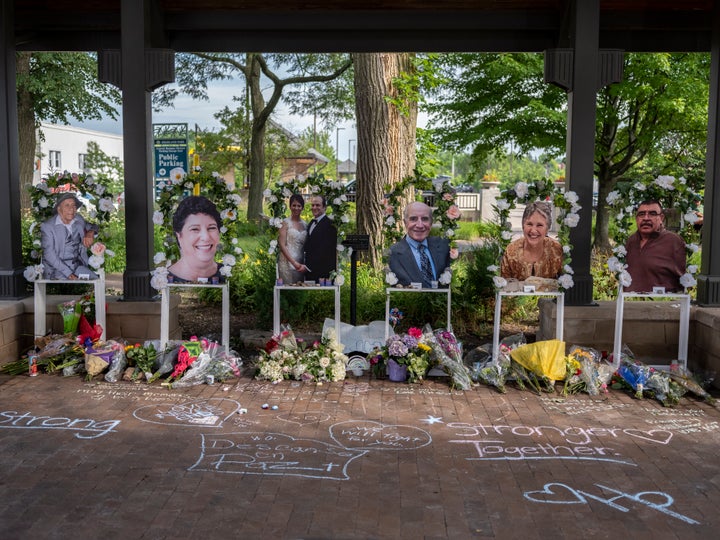 Memorials are placed near the scene of last summer's mass shooting at a Fourth of July parade in Highland Park, Illinois.