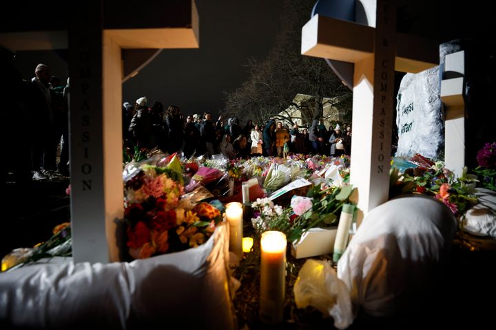 Mourners attend a vigil in honor of the students killed and injured in Monday's shootings, at The Rock on the grounds of Michigan State University in East Lansing, Mich., Wednesday, Feb. 15, 2023. (AP Photo/Al Goldis)