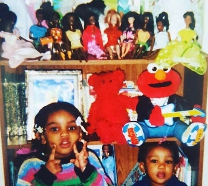 Zehira Jirves and her sister pose in front of their Barbie collection at their grandmother's home.