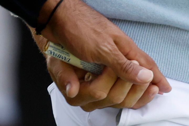 A close-up shows that Woods did indeed hand Thomas a tampon during the tournament, sparking a lot of fan chatter.