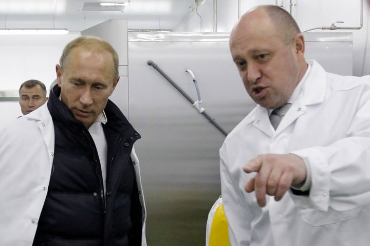 Prigozhin shows Russian Prime Minister Vladimir Putin his school lunch factory outside Saint Petersburg on September 20, 2010
