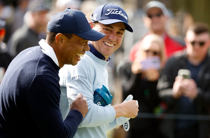 Woods and Thomas share a laugh after Woods surreptitiously gave him a tampon.