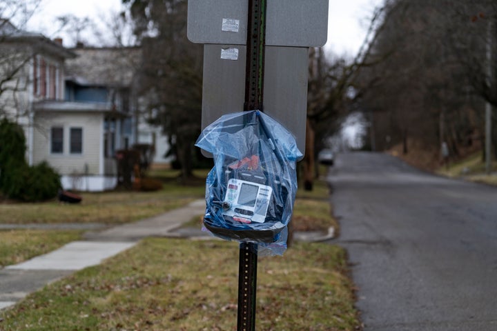 EAST PALESTINE, OH - FEBRUARY 17: An air quality monitor hangs on a stop sign near the site of a train derailment prompting health concerns on February 17, 2023 in East Palestine, Ohio. On February 3rd, a Norfolk Southern Railways train carrying toxic chemicals derailed causing an environmental disaster. Thousands of residents were ordered to evacuate after the area was placed under a state of emergency and temporary evacuation orders. (Photo by Michael Swensen/Getty Images)