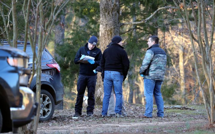 Law enforcement personnel investigate the scene of multiple shootings on Arkabutla Dam Road in Arkabutla, Mississippi, on Feb. 17. Six people were fatally shot at multiple locations in a small town in rural Mississippi near the Tennessee state line, and authorities blamed a lone suspect who was arrested and charged with murder.