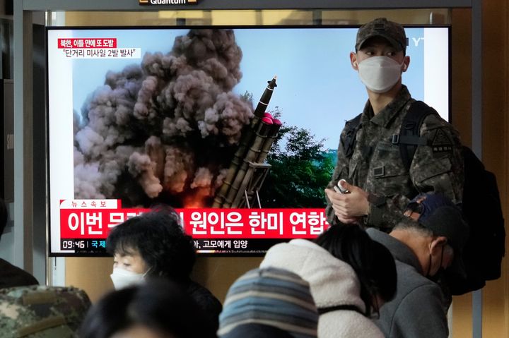 A TV screen shows a file image of North Korea's missile launch during a news program at the Seoul Railway Station on Monday. North Korea has fired a pair of short-range ballistic missiles off its east coast on Monday, South Korea's military said.