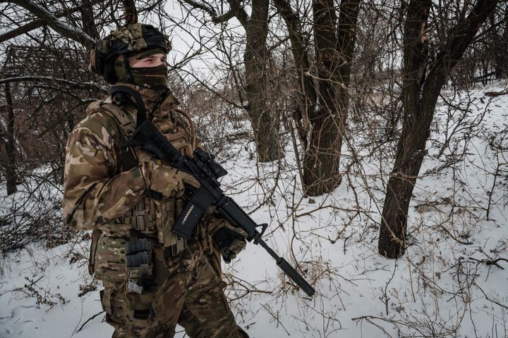 A serviceman of the Ukrainian Armed Forces patrols on the frontline near Bakhmut on February 18, 2023.