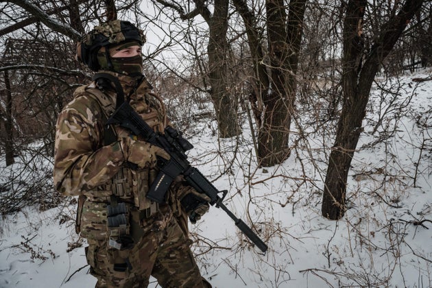 A serviceman of the Ukrainian Armed Forces patrols on the frontline near Bakhmut on February 18, 2023.