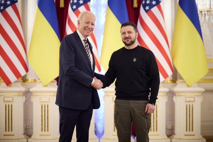 Ukrainian President Volodymyr Zelenskyy, right, and U.S. President Joe Biden shake hands during their meeting in Kyiv, Ukraine.