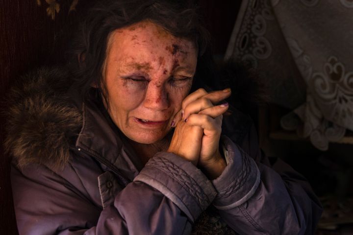 Leda Buzinna, 56, cries as she sits inside her home that was seriously damaged by shelling overnight on October 4, 2022 outside of Kramatorsk district in Krasnotorka, Ukraine. 