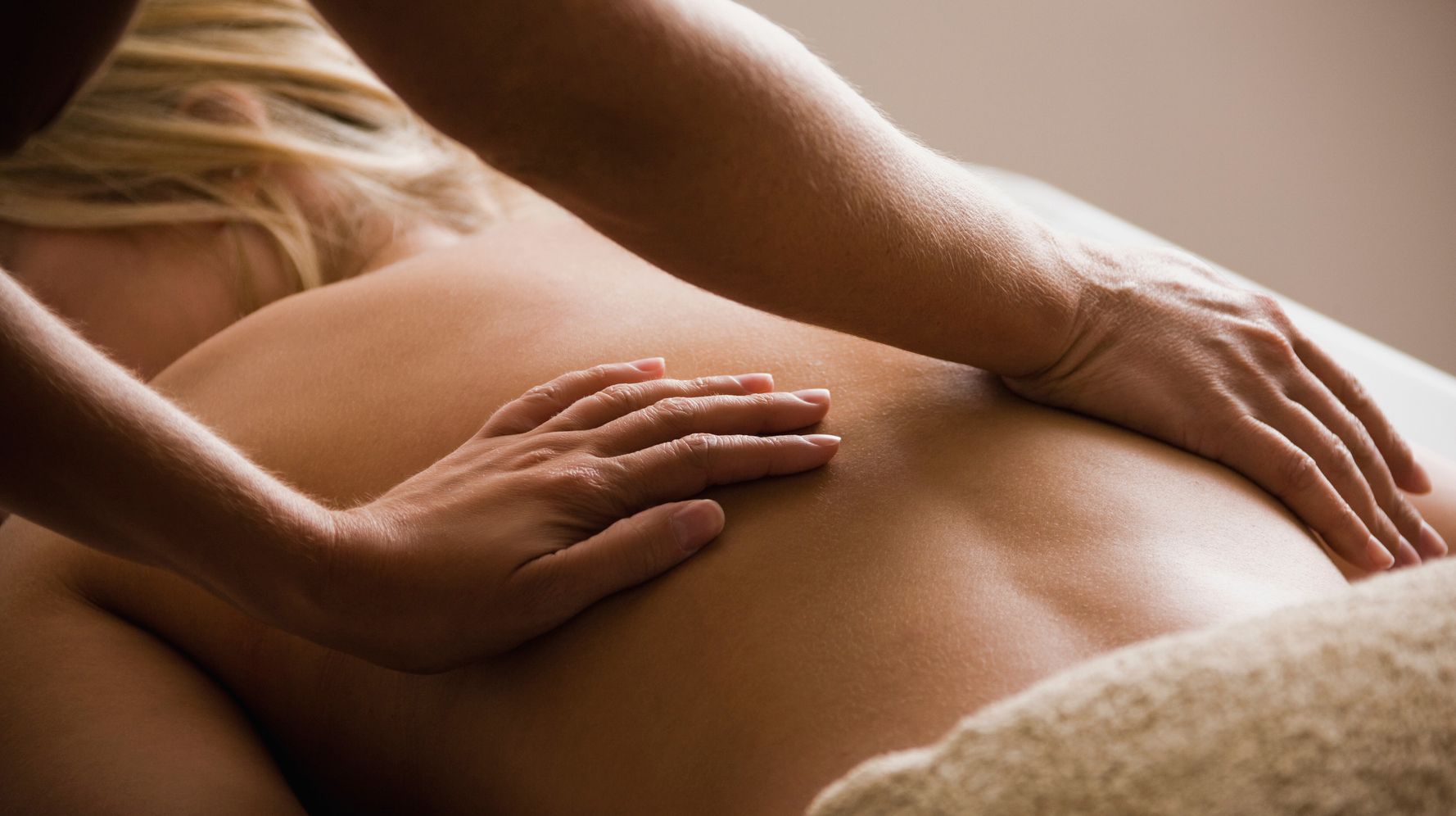 Massage Gun Treatment. Physical Therapist Massaging Man's Lower