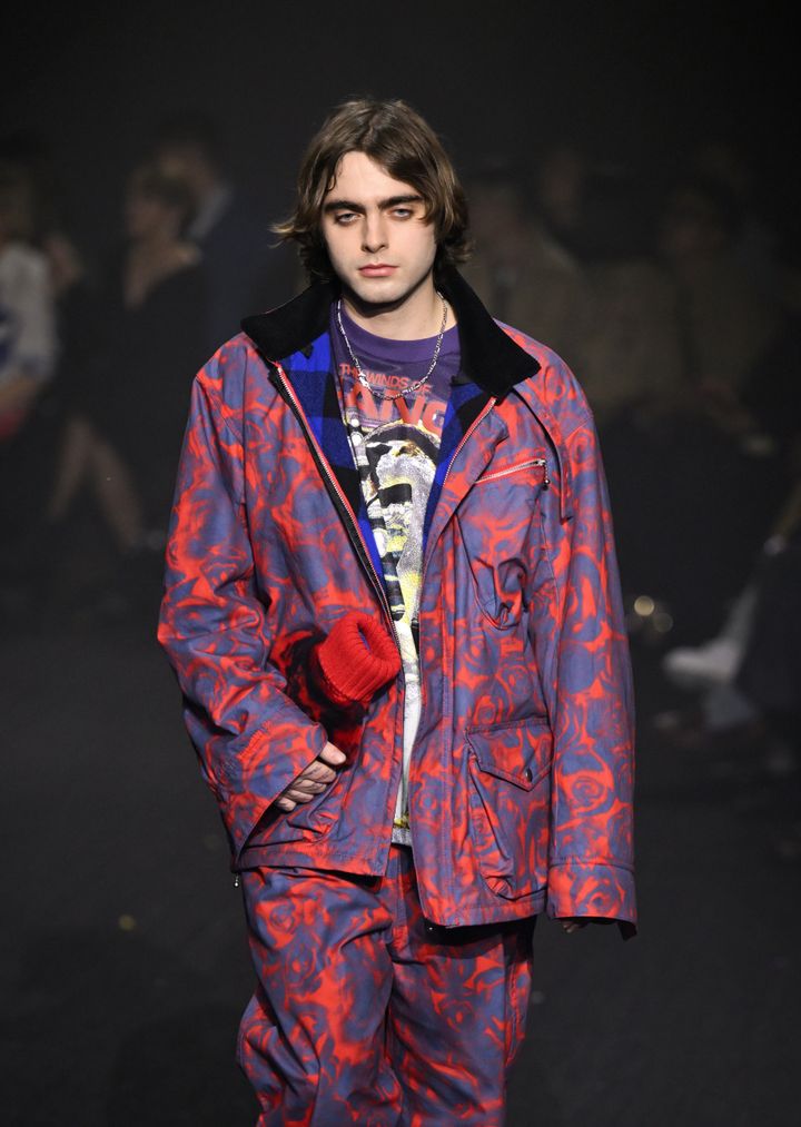 Lennon Gallagher, son of Oasis singer Liam Gallagher, walks for Burberry with a bottle in hand. 