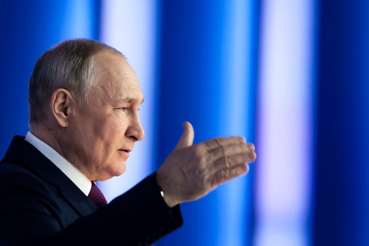 Russian president Vladimir Putin gestures as he gives his annual state of the nation address in Moscow, Russia.