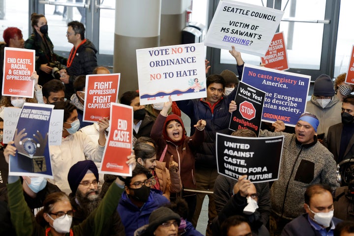 Supporters and opponents, such as Livi Nivarthi, center pointing, attempt to outyell each other during a rally at Seattle City Hall regarding a proposed ordinance to add caste to Seattle's anti-discrimination laws, Tuesday, Feb. 21, 2023, in Seattle. Council Member Kshama Sawant proposed the ordinance. (AP Photo/John Froschauer)