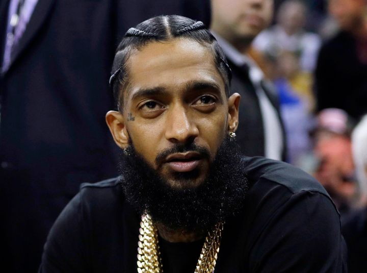 FILE - Rapper Nipsey Hussle attends an NBA basketball game between the Golden State Warriors and the Milwaukee Bucks in Oakland, Calif., March 29, 2018.