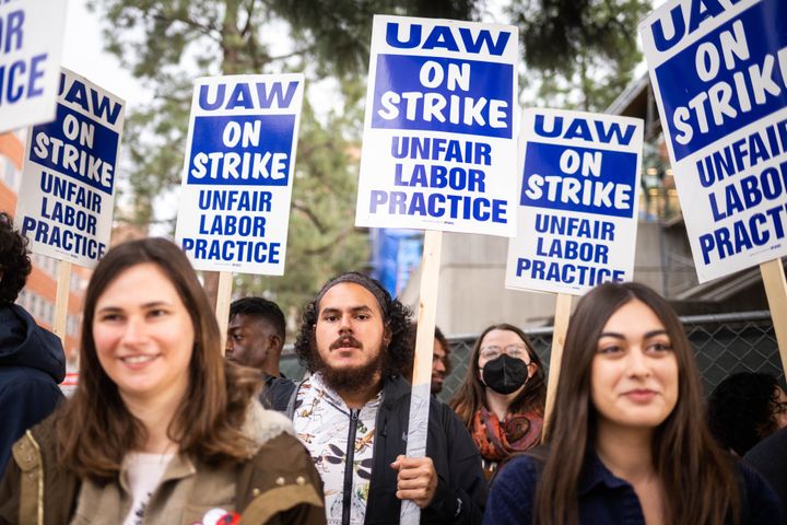 UCLA postdoctoral scholars and academic researchers march in Westwood to demand better wages, student housing, child care and more on Dec. 1, 2022, as contract negotiations continue and thousands strike.