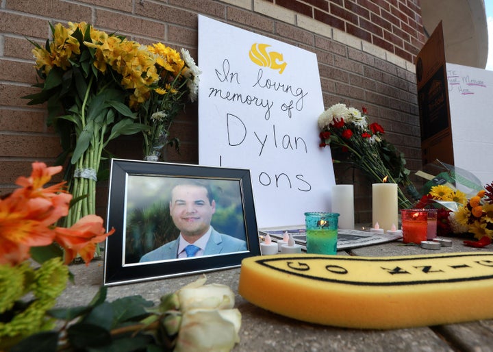 A makeshift memorial grows for slain Spectrum News 13 journalist Dylan Lyons at the University of Central Florida's Nicholson School of Communications in Orlando. Lyons was a UCF graduate.