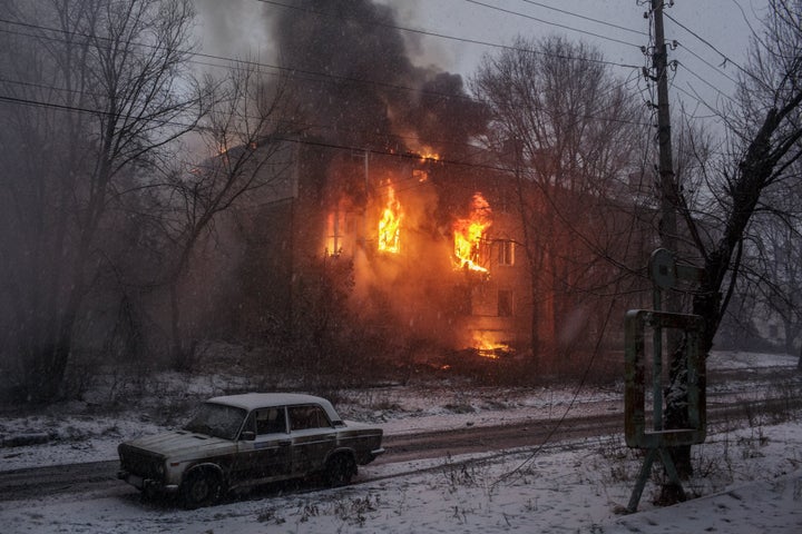 A fire broke out on a building after Russian shelling as military mobility continues within the Russian-Ukrainian war in Bakhmut, Ukraine on February 15, 2023.