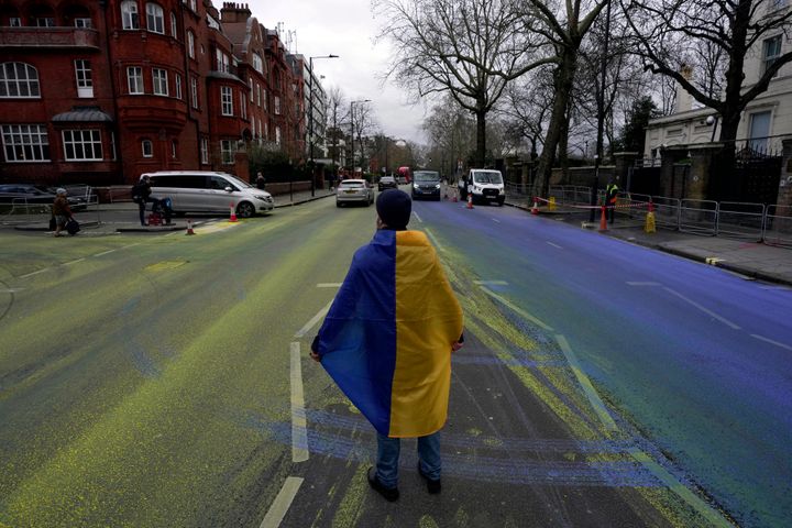 Activist artists painted a giant Ukrainian flag outside the Russian Embassy in London ahead of the one-year anniversary of the invasion of Ukraine.