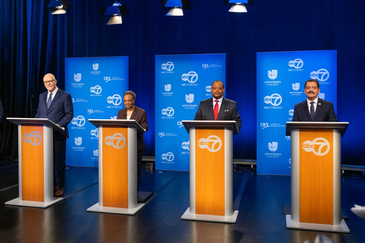 Chicago mayoral candidates (from left) Paul Vallas, Mayor Lori Lightfoot, Alderman Rod Sawyer and Rep. Jesús "Chuy" Garcia (D-Ill.), along with five other candidates, get ready to debate on Jan. 19.