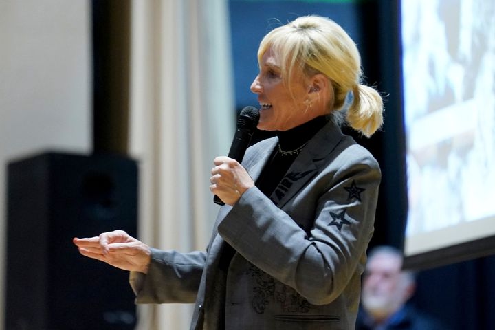 Activist Erin Brockovich speaks about the Norfolk Southern train derailment during a town hall meeting at East Palestine High School on Friday.