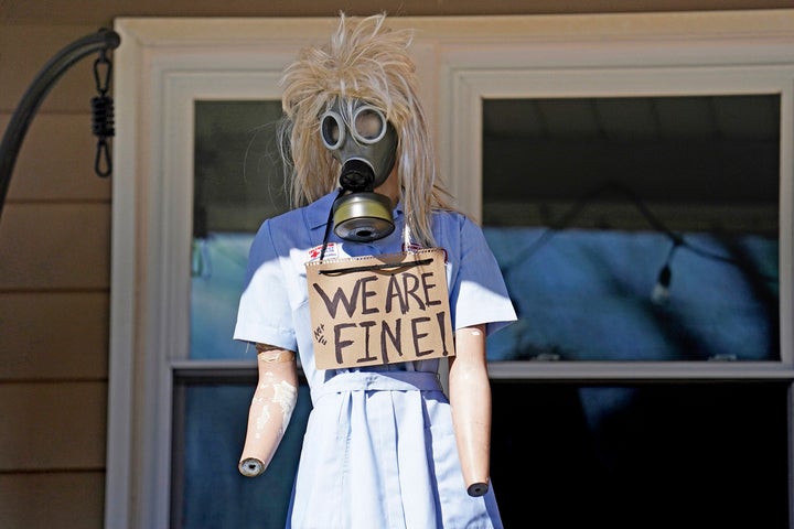 A resident displays a mannequin on their porch in East Palestine, Ohio, as cleanup from the Feb. 3 Norfolk Southern train derailment continues, Friday, Feb. 24, 2023. 