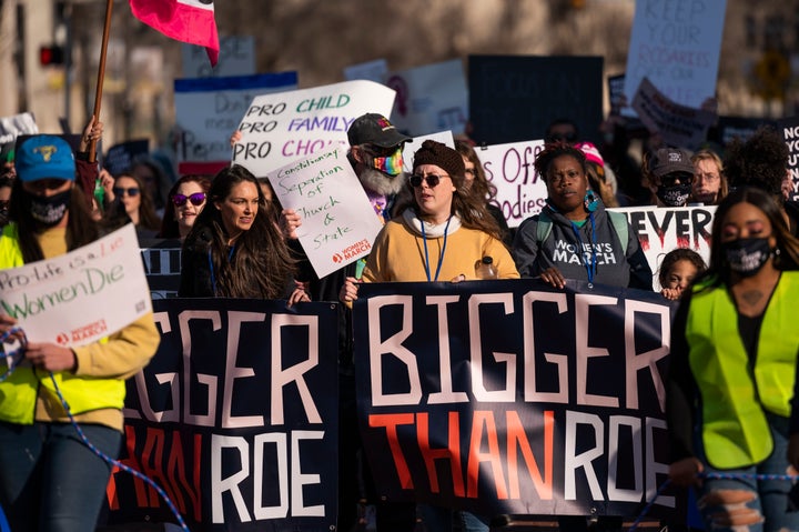 People march through downtown Amarillo to protest a lawsuit in federal court to ban the abortion drug mifepristone Saturday, Feb. 11, 2023, in Amarillo, Texas. (AP Photo/Justin Rex)