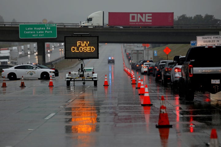 CASTAIC, CA - FEBRUARY 24: California Highway Patrol and Caltrans set up a road block along Interstate 5 at Parker Road shutting down the Grapevine on Friday, Feb. 24, 2023 in Castaic, CA. A powerful winter storm system that forecasters say will bring an extended period of cold temperatures, high winds and snow, prompting the regions first blizzard warning on record. (Gary Coronado / Los Angeles Times via Getty Images)