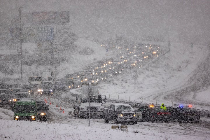 Traffic backs up on the State Route 14 freeway due to snow near Acton, California.