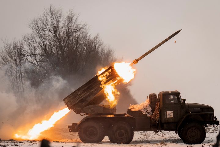 Ukrainian soldiers fire a Soviet-era Grad rocket launcher at Russian positions in the Kharkiv area on Saturday.