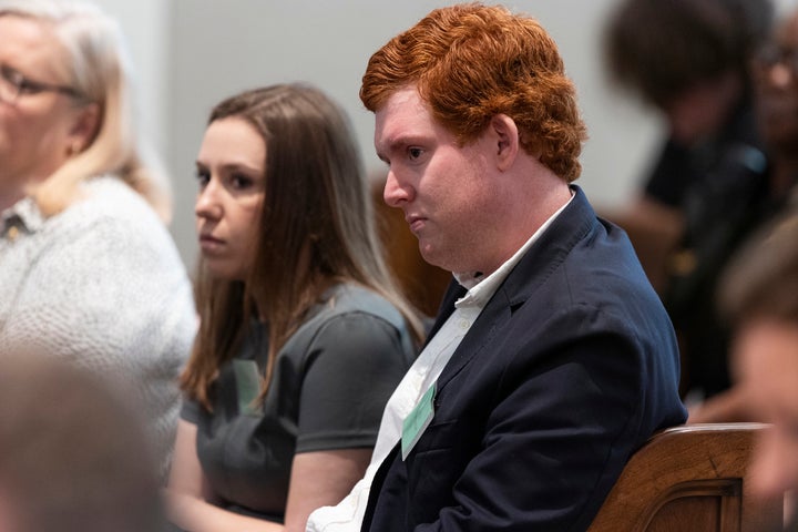 Buster Murdaugh, the son of defendant Alex Murdaugh, listens to his father testify during his murder trial on Friday.