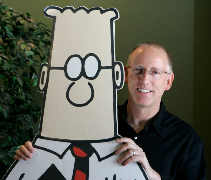 Scott Adams, creator of the comic strip Dilbert, poses for a portrait with the Dilbert character in his studio in Dublin, California.
