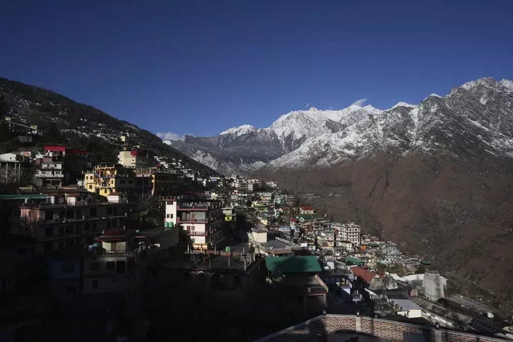 Joshimath town is seen along side snow capped mountains, in India's Himalayan mountain state of Uttarakhand, Jan. 21.