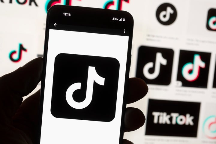 The TikTok logo is seen on a cell phone on Oct. 14, 2022, in Boston. The White House is giving all federal agencies 30 days to wipe TikTok off all government devices, as the Chinese-owned social media app comes under increasing scrutiny in Washington over security concerns.