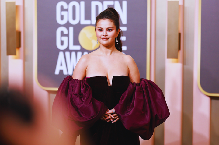 Selena Gomez, pictured here at the 2023 Golden Globes in January, has endured comments about her weight fluctuation since she's started her medication for lupus. She's not alone. 