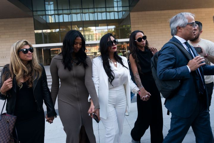 Vanessa Bryant, center, Kobe Bryant's widow, leaves a federal courthouse with her daughter Natalia, center left, soccer player Sydney Leroux, center right, in Los Angeles, on Aug. 24, 2022. The family of the late Kobe Bryant has agreed to a $28.5 million settlement with Los Angeles County to resolve the remaining claims in a lawsuit over deputies and firefighters sharing grisly photos of the NBA star, his 13-year-old daughter and other victims killed in a 2020 helicopter crash, attorneys and court filings said Feb. 28, 2023.
