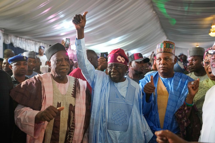 Bola Tinubu of the All Progressives Congress, center, celebrates with supporters at the party's campaign headquarters after winning the presidential elections in Abuja, Nigeria, on March 1, 2023. Election officials declared ruling party candidate Tinubu the winner of Nigeria's presidential election with the two leading opposition candidates already demanding a re-vote in Africa's most populous nation.