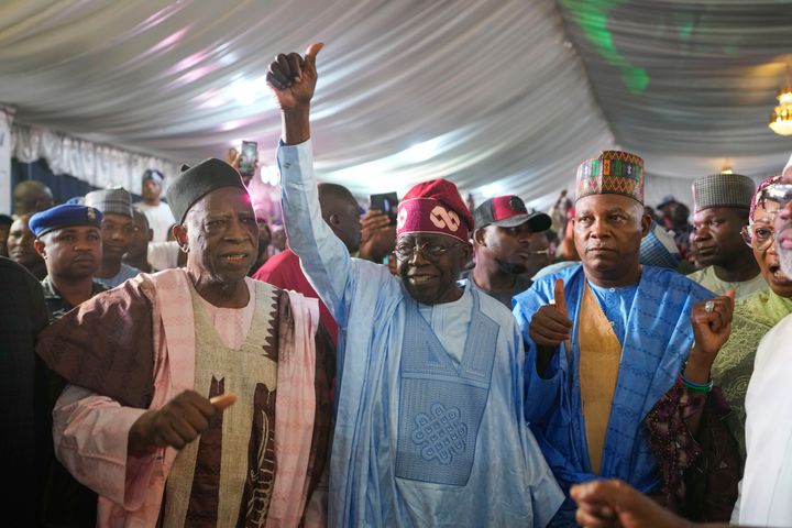 Bola Tinubu of the All Progressives Congress, center, celebrates with supporters at the party's campaign headquarters after winning the presidential elections in Abuja, Nigeria, on March 1, 2023. Election officials declared ruling party candidate Tinubu the winner of Nigeria's presidential election with the two leading opposition candidates already demanding a re-vote in Africa's most populous nation. 