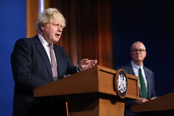 Chief scientific adviser Sir Patrick Vallance (right) was among the people who had to explain the numbers to then-prime minister Boris Johnson.