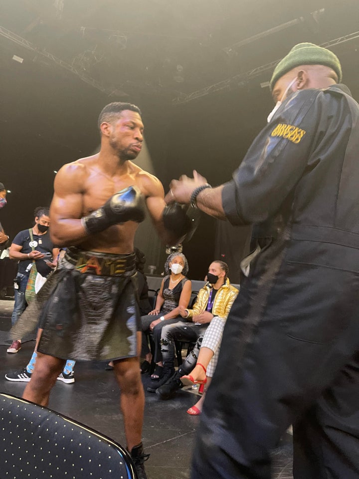 Yahya McClain (right) trains Jonathan Majors (left) in the upcoming film "Creed III." McClain told HuffPost that Majors remained focused on set with a "total disregard for anyone that’s around when he is in his mood."