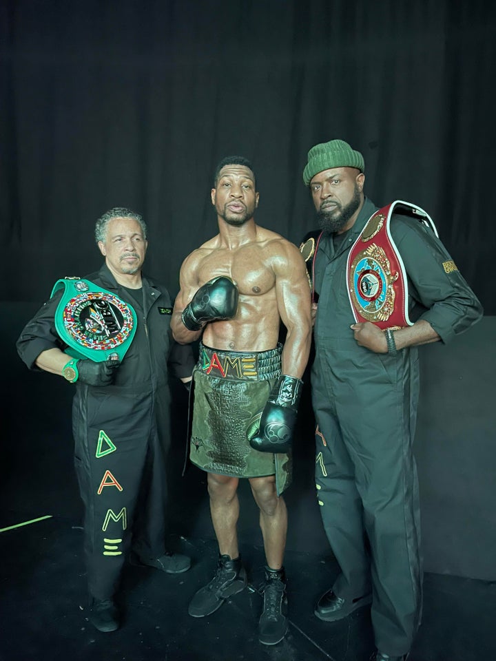 McClain (right) poses alongside Majors (center) and Lamont Lankford (who plays Damian's cutman) on the set of "Creed III."